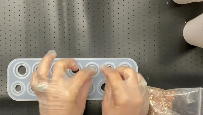 Add glitter to the resin mixture. (Consider putting glitter in the mold first for small molds)