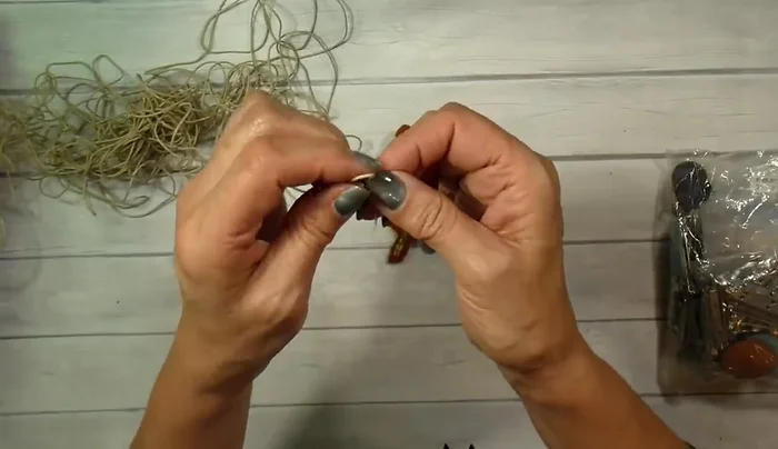 Attach a jute loop for hanging using free motion stitching; avoid stitching through the knot.