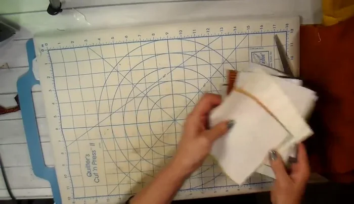 Create a sandwich with your fabric, die, and cardstock shim. Run it through your Big Shot die-cutting machine.