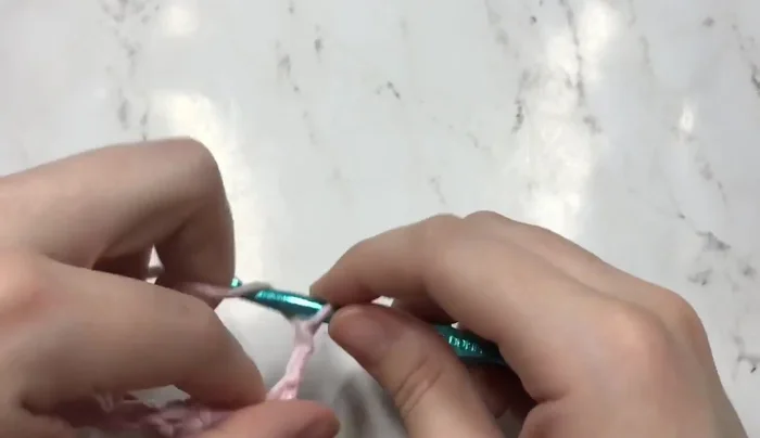 Optional: Add another rod at the bottom and single crochet across it.