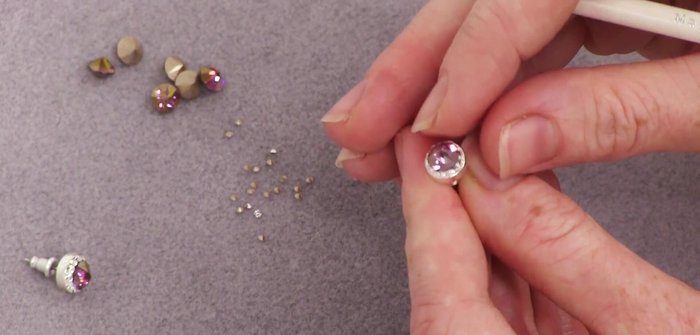 Press all crystals into the clay to secure them and ensure proper centering.