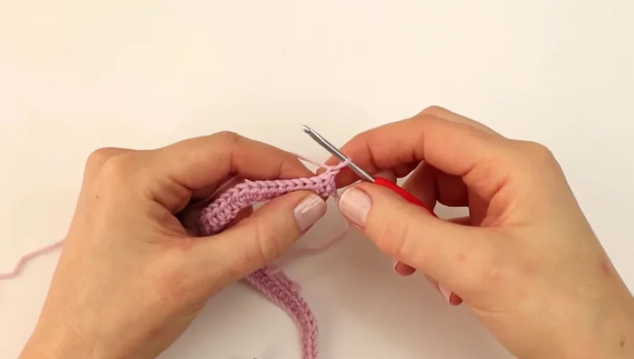 Repeat rows 2 and 3, increasing 3 hdc in each corner until you have 14 rows. The written pattern provides exact stitch counts between increases.