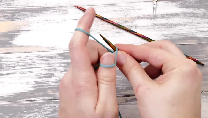 Cast on 32 stitches using a long tail cast-on, leaving a 5-6 inch tail for weaving in later.