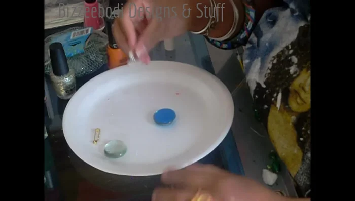 Carefully attach the gem to the ring mount or pin back. Ensure the adhesive is evenly distributed to avoid air bubbles.