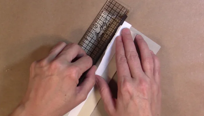 Once all gussets are in place, insert the chipboard pieces that will serve as pages.