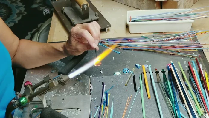 Heat the green dots, pulling them slightly toward the center to blend them into the base.