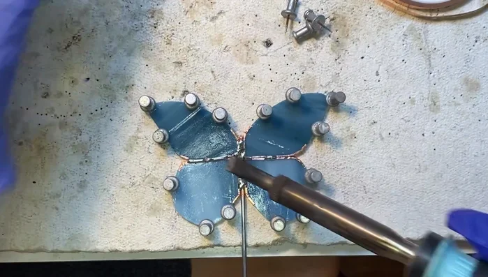 Add more solder as needed to secure the attachment.