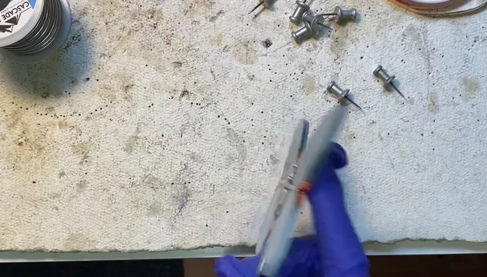 Repeat the soldering process on the back of the piece.