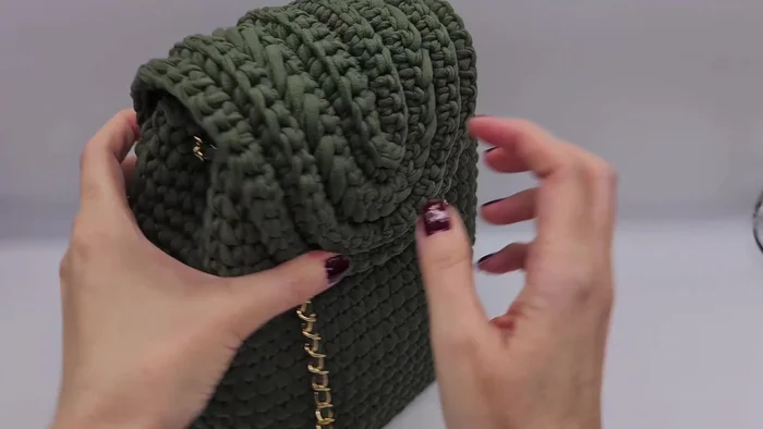 Sew the top to the back of the backpack.