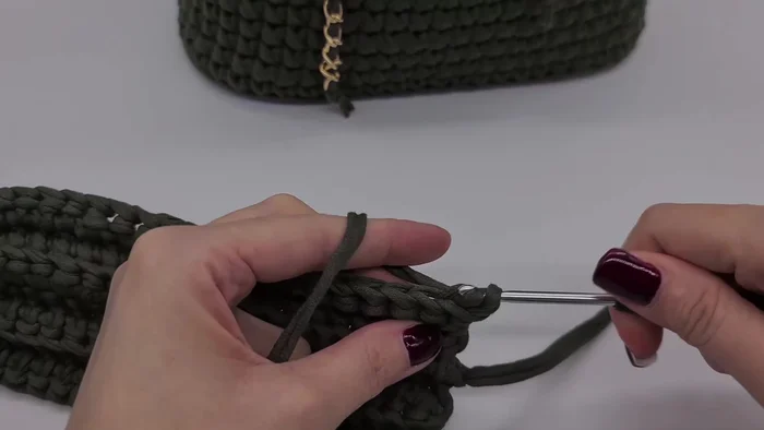 Continue adding rows until desired height is reached; hold the top of the backpack occasionally to check the width.