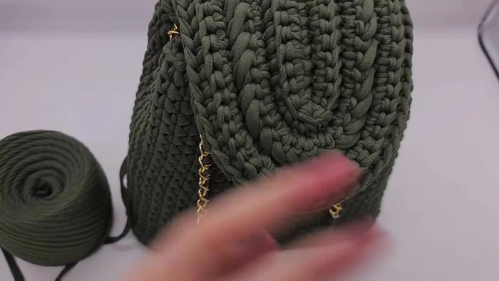 Continue adding rows until desired height is reached; hold the top of the backpack occasionally to check the width.