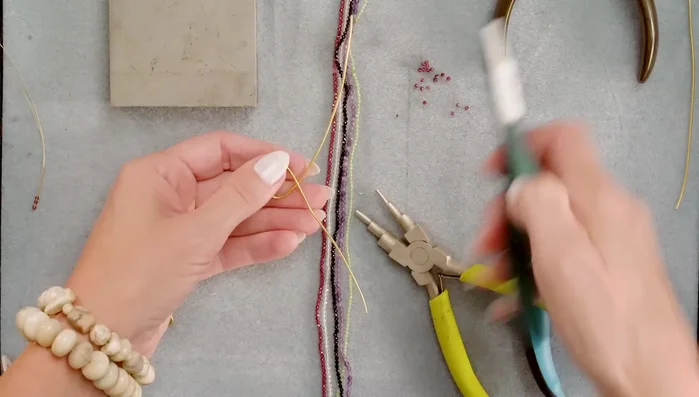 Trim the excess wire with flush cutters and squeeze the end flat with pliers.