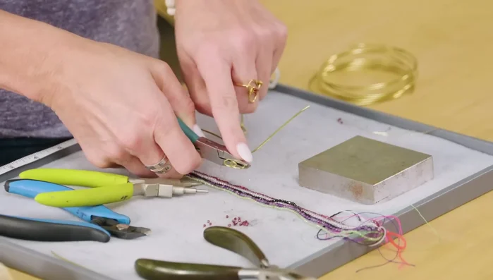 Trim the excess wire with flush cutters and squeeze the end flat with pliers.