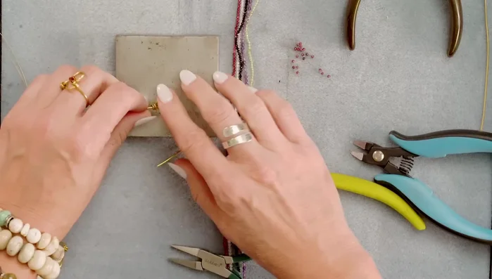 Lightly hammer the edges of the heart using a chasing hammer and bench block for added detail.