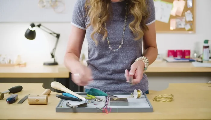 Bend the U-shaped wire around a ring mandrel to size 7.