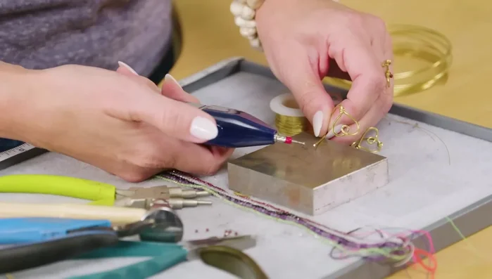 Use a chasing hammer to shape the paddle.