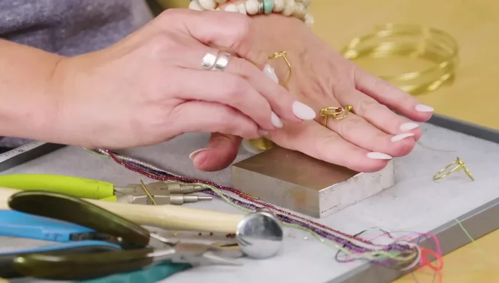 Add accent beads (optional) by stringing them onto 26-gauge wire and securing them to the center of the heart.
