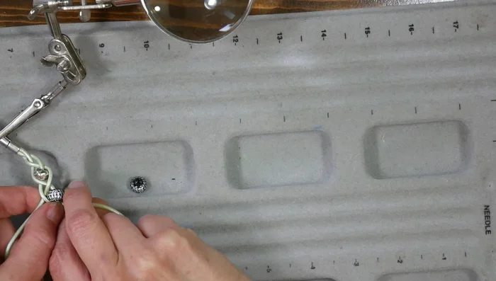 Create a simple beaded bracelet: Braid three cords together, adding beads, and glue to magnetic clasps.