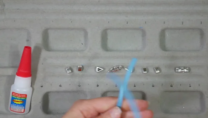 Create a stretch bracelet: String beads onto stretch cord, tie three square knots, hide the knot within a spacer bead, and trim.