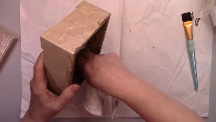 Use a damp sponge and iced espresso wax rub on the edges for added distressing.