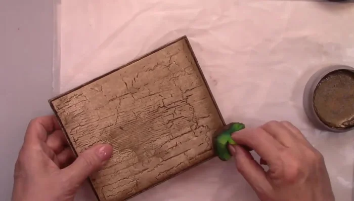 Use a damp sponge and iced espresso wax rub on the edges for added distressing.