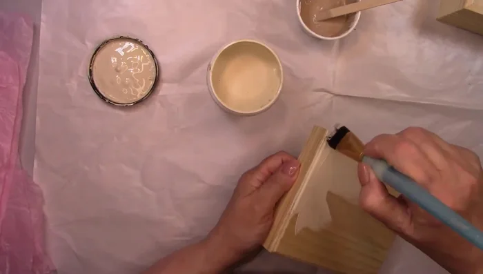 Apply scrunched tissue paper onto wet paint, pressing wrinkles into the paint, then remove.