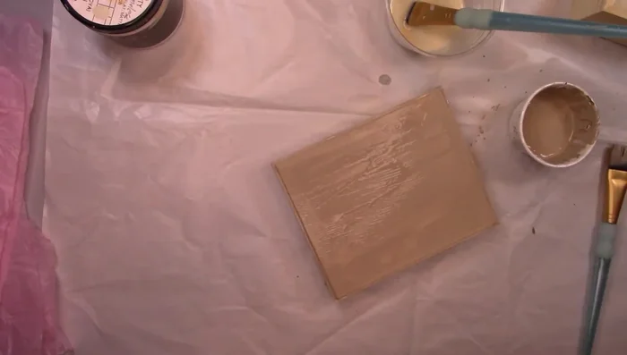 Apply scrunched tissue paper onto wet paint, pressing wrinkles into the paint, then remove.