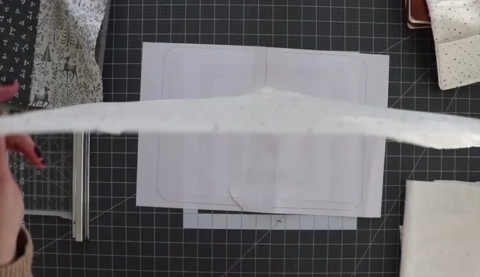 Quilt the cover: Layer the cover fabric, batting, and backing fabric. Baste layers together and quilt. Cut the quilted cover using the template as a guide, cutting along the outermost line.