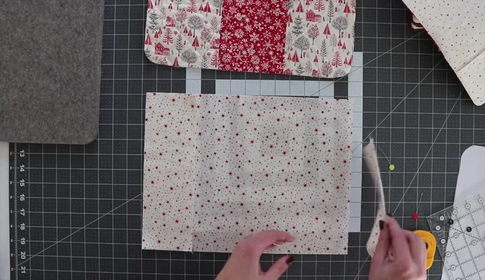 Attach pockets: Position pockets onto the uncut rectangle, stitching them in place with a basting stitch.