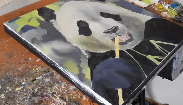 Blocking in with oils: Loosely apply initial colors for nose, muzzle, eyes, and background without precise color matching.