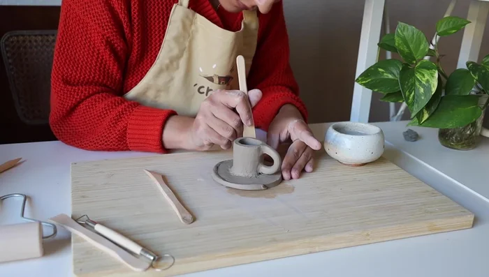 Final touches: Trim and smooth any excess clay until the piece is finished.