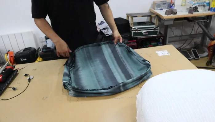 Stuff the Cushion: Turn the cushion right-side out and fill with Dacron stuffing.