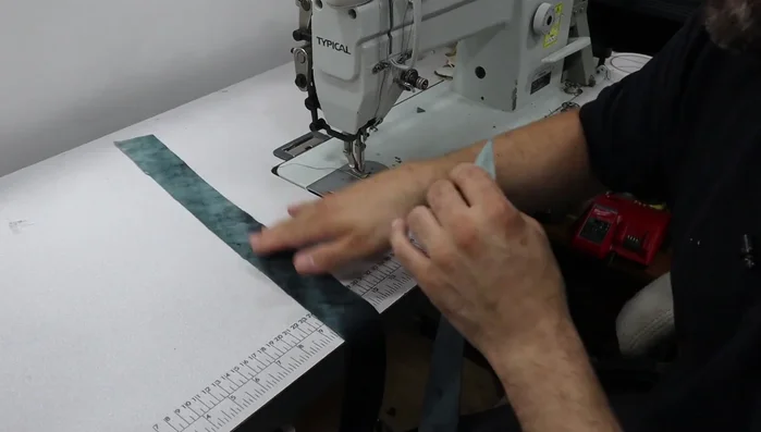 Attach the Piping: Insert the piping cord into the bias strips, fold over, and stitch close to the cord using a piping foot. Join piping pieces carefully, making neat joints. Attach the piping to the cushion pieces, using small snips along curves to ensure a flat finish.