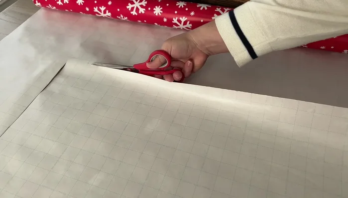 Create a paper template of the drawer, marking sections for dividers based on item sizes and desired layout. Use graph paper or tape together pieces of paper to create a template.