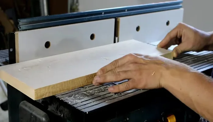 Rip the boards into strips slightly over 1 3/4 inches wide (using a band saw or table saw).