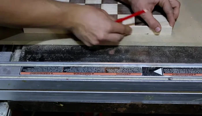 Mark and cut the other side of the maple strips to fit the chest board. Glue them on in two stages for easier alignment.