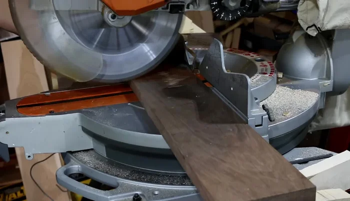 Prepare walnut border pieces: Cut strips at 19 inches long and rip them to slightly over 1 3/4 inches. Plane to final width. Repeat the same steps as for the maple border pieces.