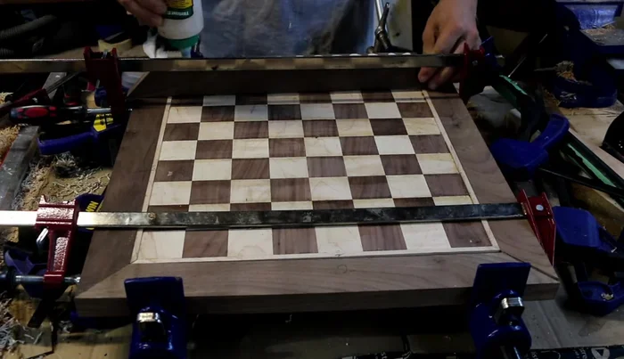 Glue on walnut border pieces, doing a dry fit first for proper alignment.