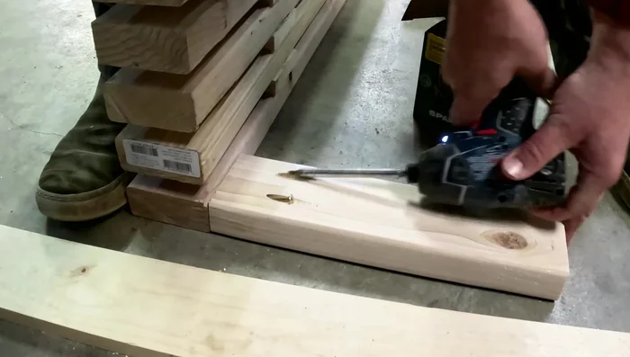 Attach legs to the benchtop using screws through the pocket holes, ensuring pocket holes face away from the front.