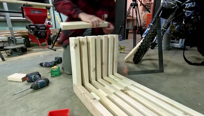 Attach baseboards to the legs, using a 1x4 spacer to maintain even spacing between legs.