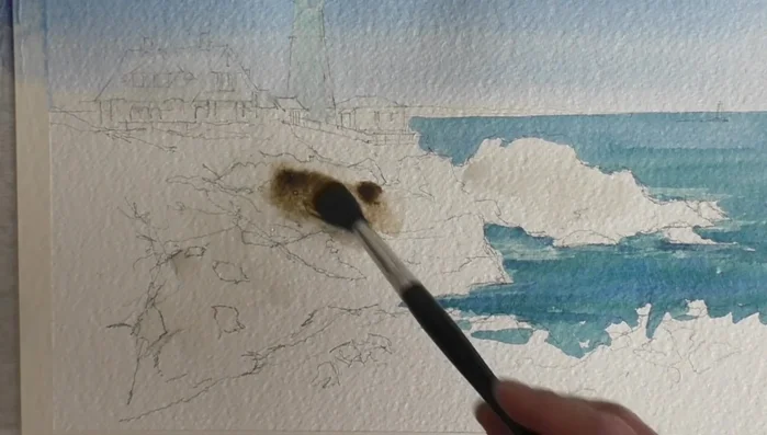 Use dry brushing with Sepia to create darker values in the rocks.