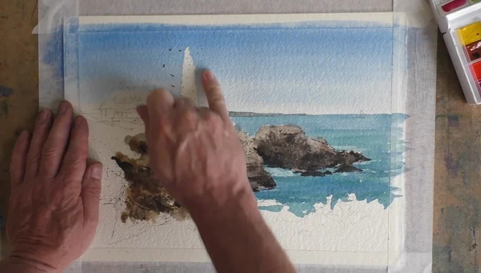 Add a soft shadow to the lighthouse and subtle details with Payne's Grey.