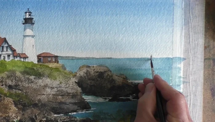 Use a beige pastel pencil for light sections of the fence and beach.