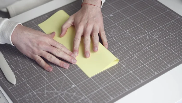 Stitching: Stitch signatures together using bookbinder's thread and a needle, keeping tension consistent. Secure knots at the beginning and end.
