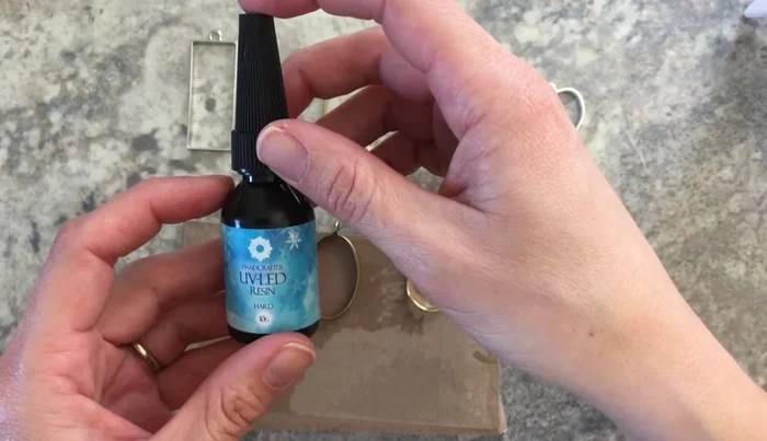 Cure the first layer of resin with UV light.