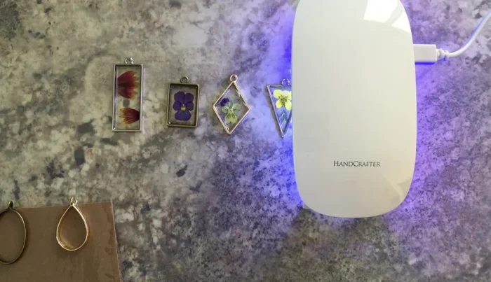 Cure the first layer of resin with UV light.