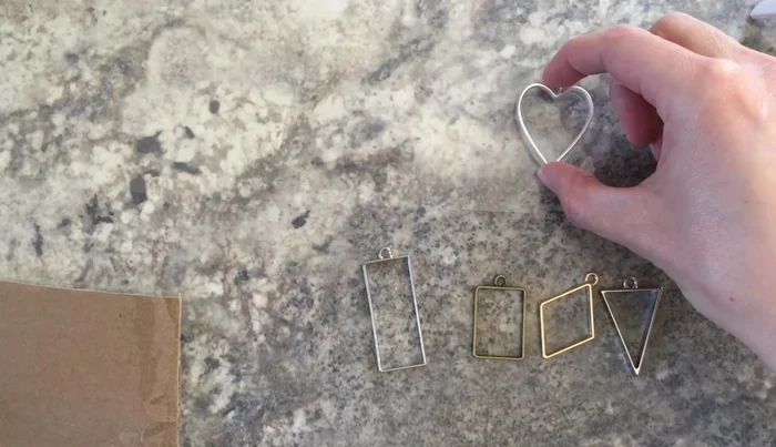 Secure bezels to packing tape using additional tape if needed to ensure they lay flat.