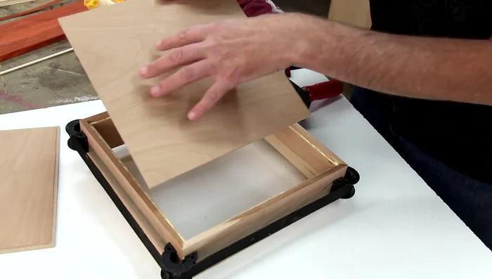 Glue the top and bottom panels, ensuring the cherry veneer is on the outside of the bottom.