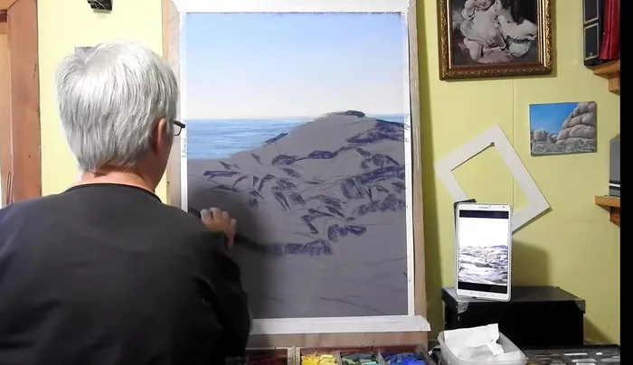 Adding lighter highlights (grays and lighter colors) to the tops of the rocks, blending with the hand in the direction of the rock shapes.