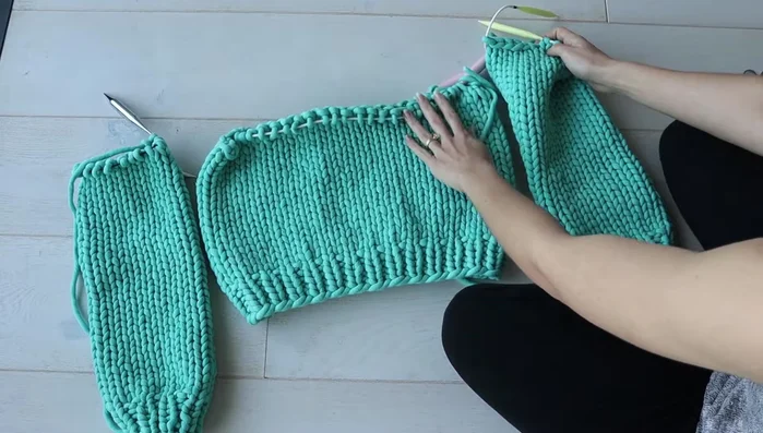 Bind off stitches at the underarm area of both the body and sleeves. These bound-off stitches will mark the underarm seam.